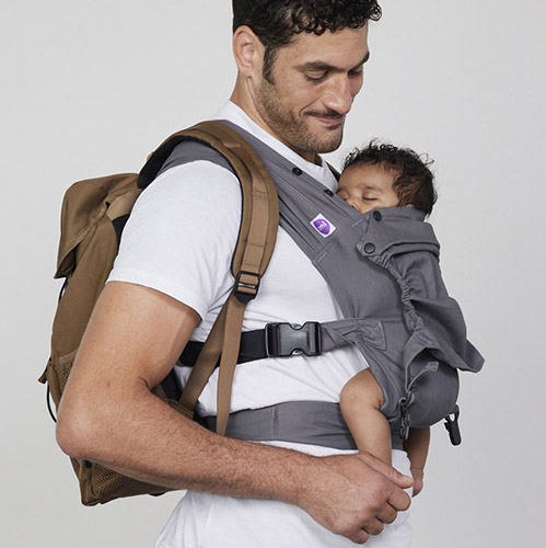 Man carries baby on his chest in Izmi Baby Carrier