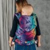 Woman carries toddler on her back in Lenny Lamb LennyHybrid Preschool toddler carrier in Jurassic Park New Era, back view