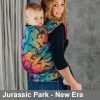 Woman carries toddler on her back in Lenny Lamb LennyHybrid Preschool toddler carrier in Jurassic Park New Era, side view