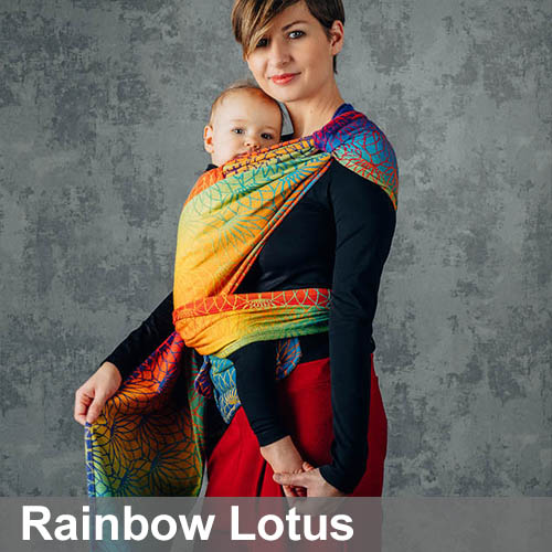 Woman carrying baby on her front in Lenny Lamb Lenny Hybrid Half Buckle Baby Carrier in Rainbow Lotus