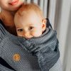 Close up of woman carrying baby in Lenny Lamb Wrap Tai baby carrier in Little Herringbone Ombre Grey fabric