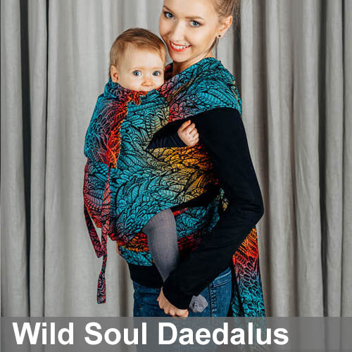 Woman carrying baby in Lenny Lamb Wrap Tai baby carrier in Wild Soul Daedalus fabric, side view