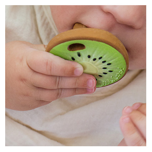 Baby chews kiwi shaped rubber teething toy by Oli & Carol